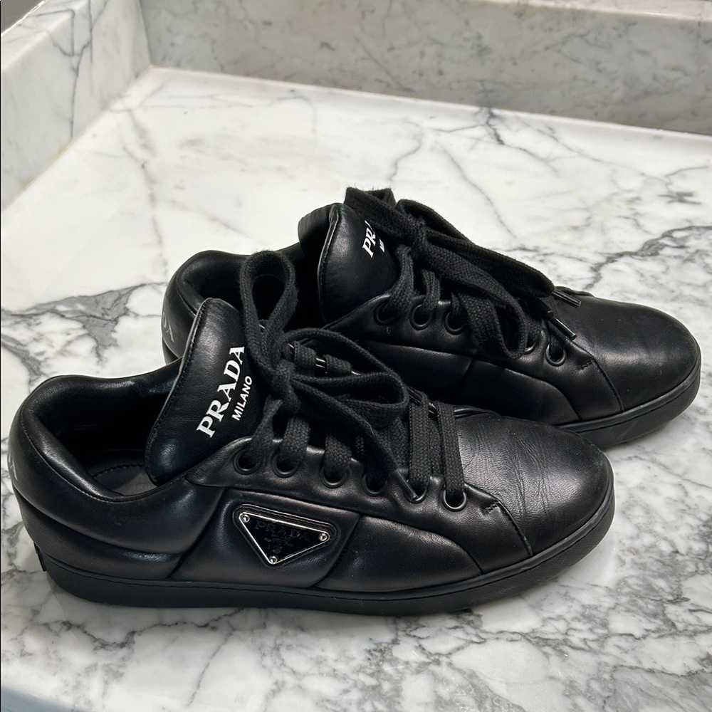 Prada Black Leather Low-Top Sneakers with Metal Triangle Logo